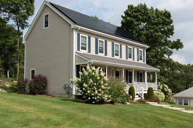 Traditional Home With Solar Panel Roofing